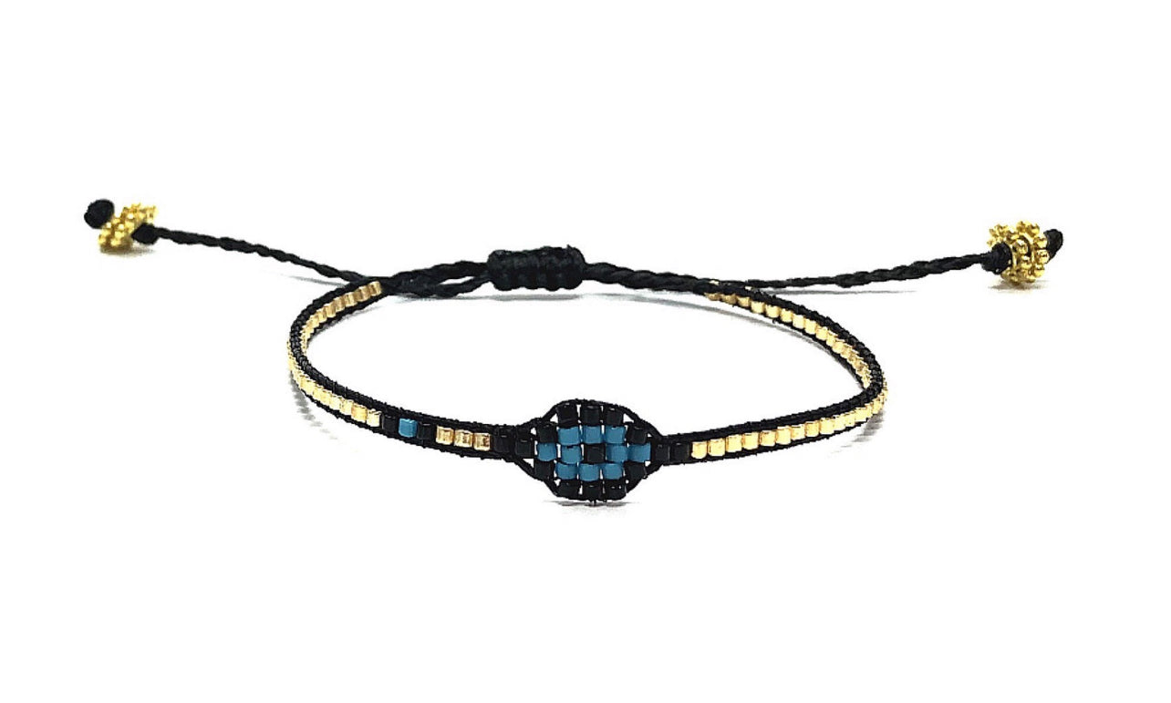 Delicate eyebead bracelet in gold